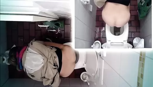 Hidden camera in the toilet and pooping woman